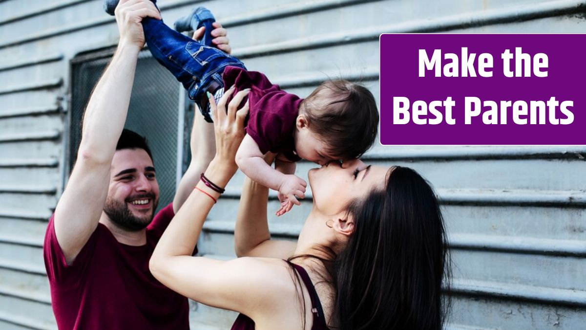 Young beautiful family with child posing on grey wall.